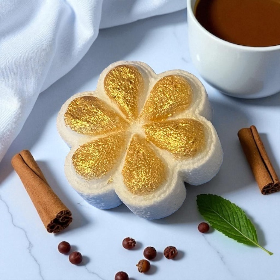 A handmade Biscoff scented gold painted shower steamer