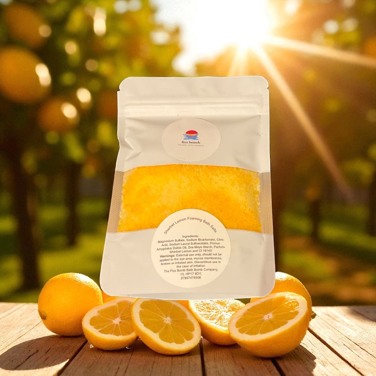 Yellow coloured packaged bath salts with a lemon themed background