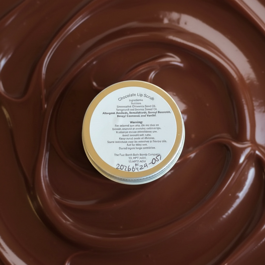 A tin of lip scrub with a chocolate background