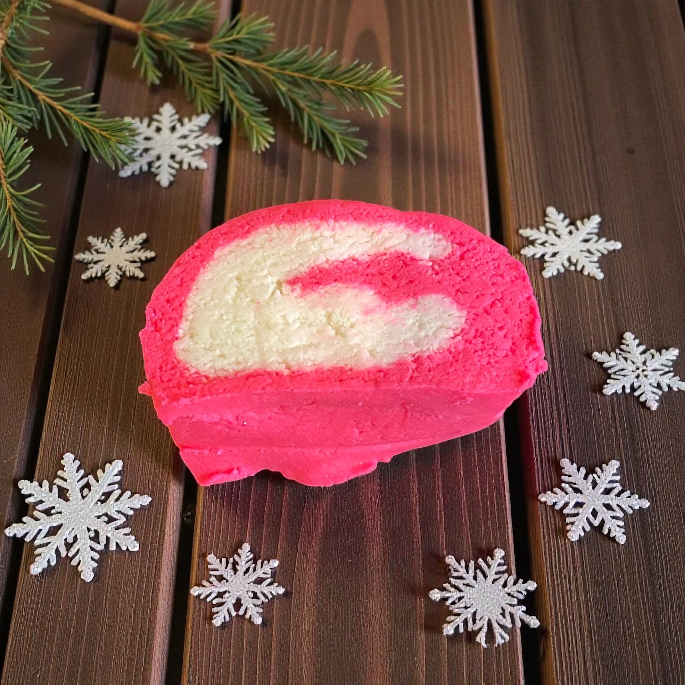Pink and white bubble bar with Christmas decorations on a wooden surface