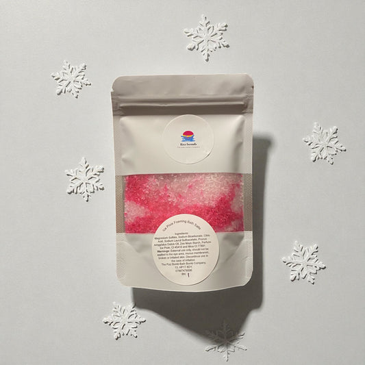 Packaged product with a label on a light gray background with snowflake decorations