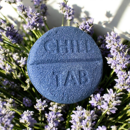 A lavender scented violet coloured chill tab shaped handmade Bath bomb