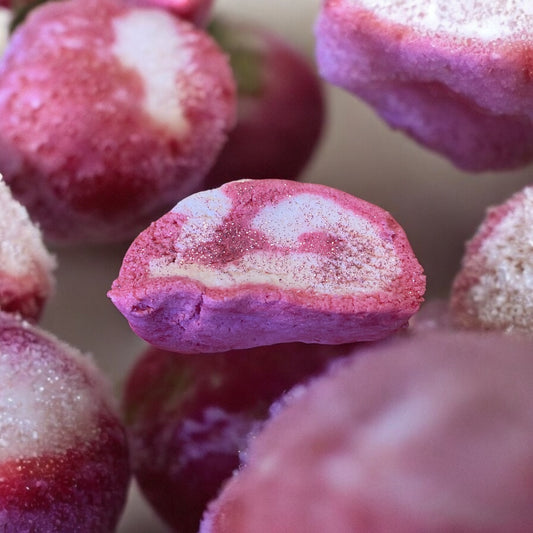 Close-up of red and white striped bubble bar with a blurred background