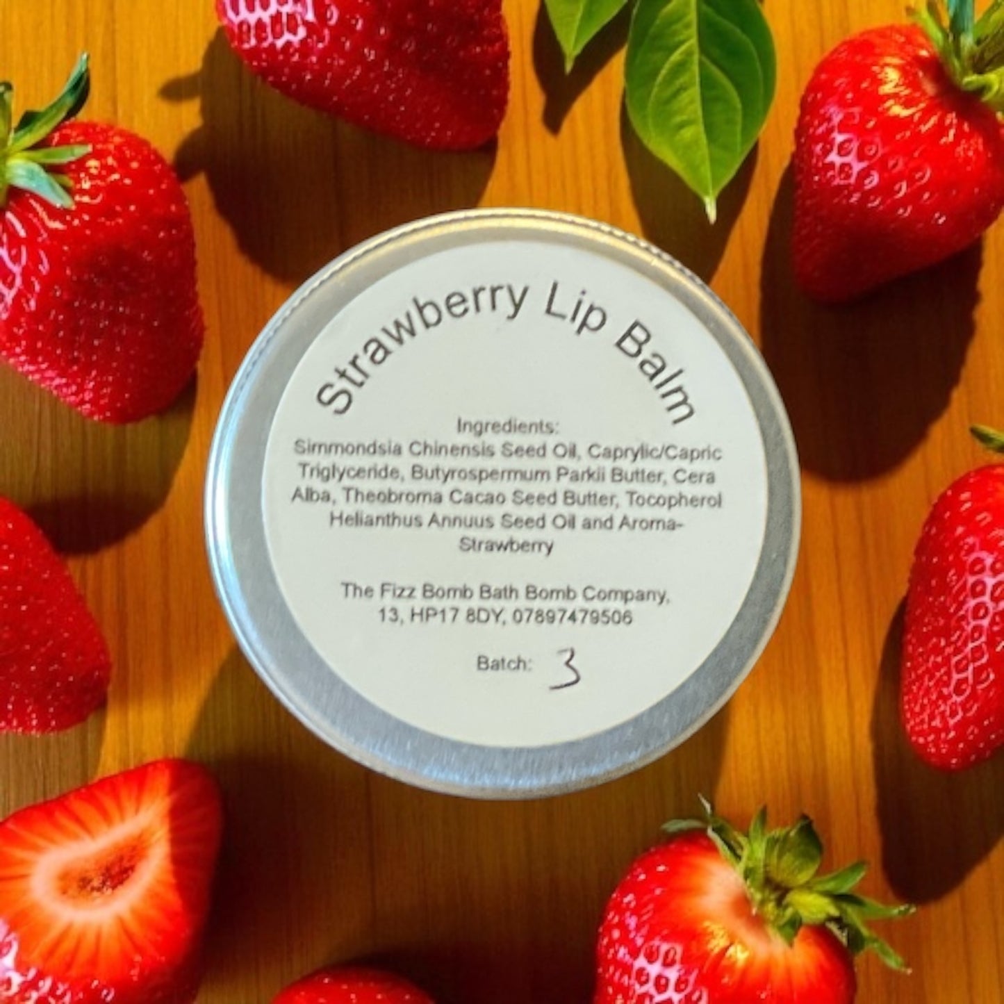 A handmade strawberry flavoured lip balm